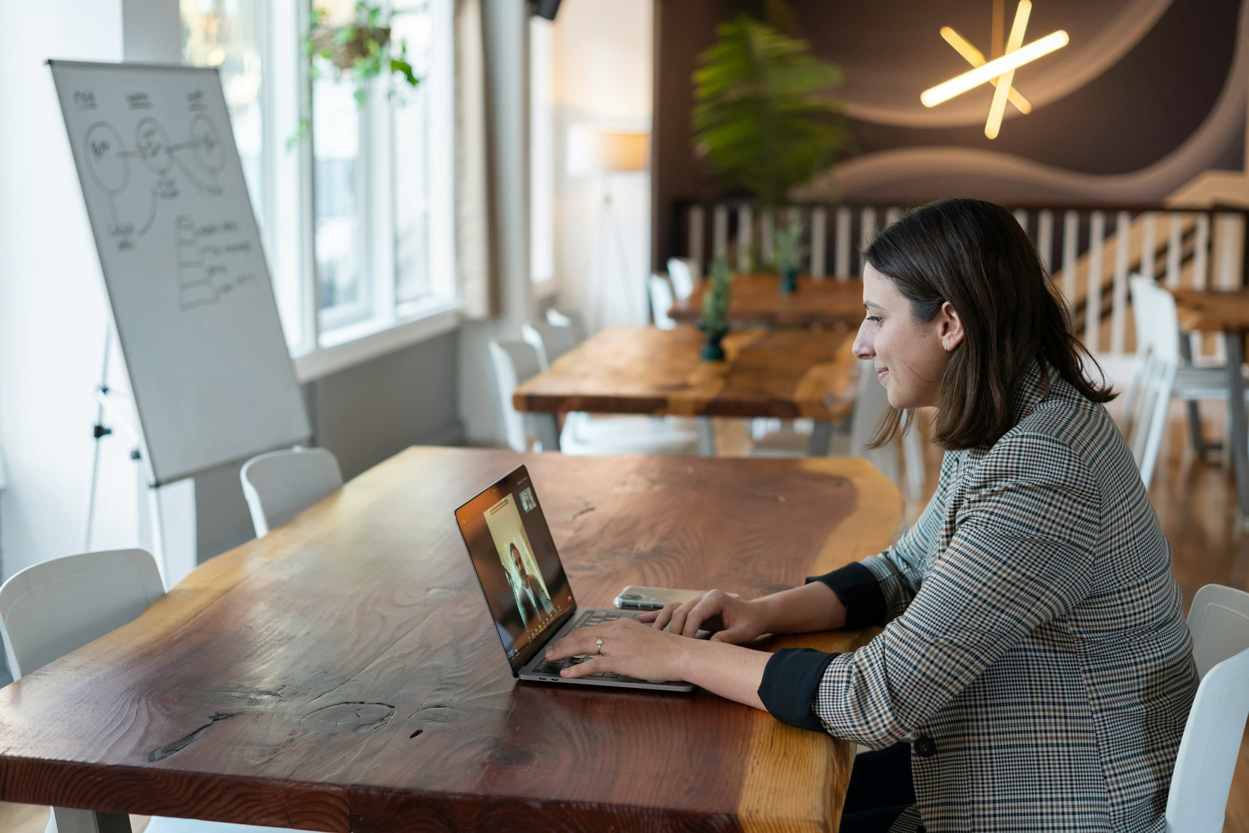 Expert sharing advice over a video call from a co-working space